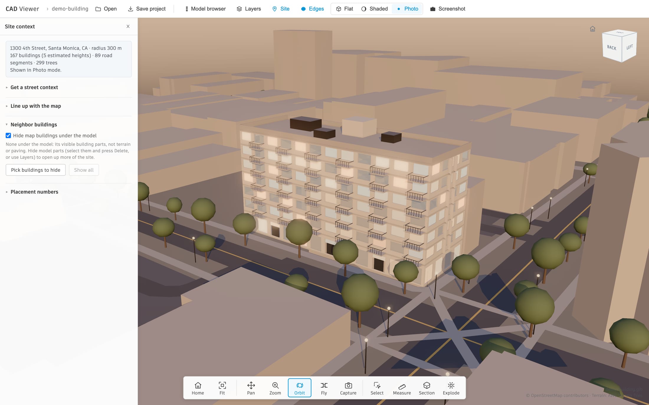 The viewer in Photo mode with its Site panel open: the demo building stands on a corner lot on 4th Street in downtown Santa Monica at golden hour, among real neighboring buildings at their mapped heights, with towers behind, street trees, street lights and a crosswalk. The panel reads 167 buildings, 89 road segments and 299 trees within 300 meters.